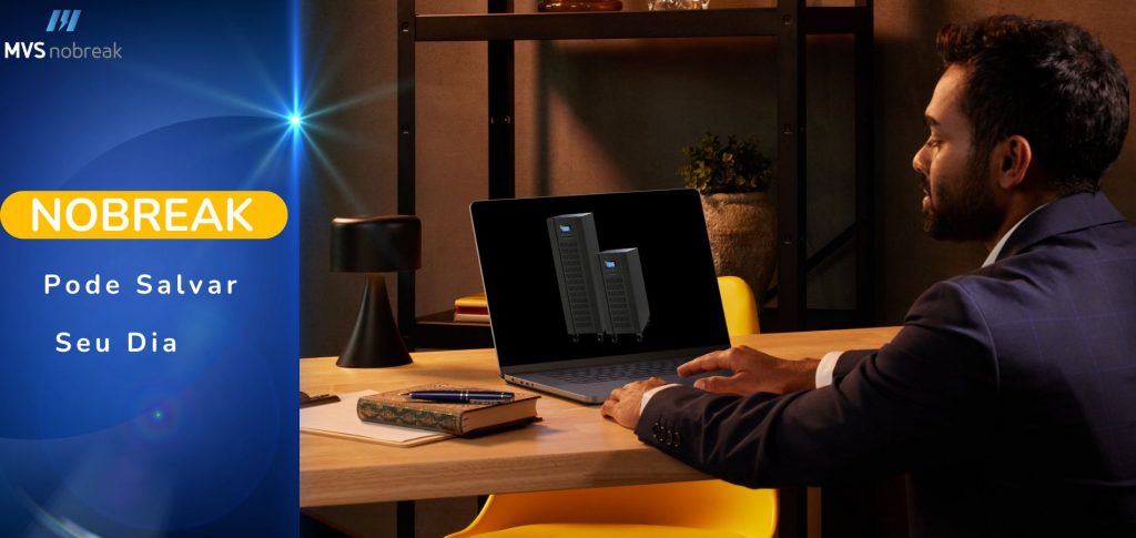 A imagem apresenta um homem de negócios sentado à mesa em um ambiente de trabalho bem iluminado, olhando para a tela de um laptop. Na tela, são exibidos dois modelos de nobreaks. O fundo da imagem tem um tom aconchegante, com iluminação suave e elementos decorativos modernos, como uma luminária e um vaso com planta.

No lado esquerdo da imagem, há um banner azul com o logotipo da empresa "MVS Nobreak" no topo. Abaixo, uma chamada de destaque em letras grandes amarelas e brancas diz: "NOBREAK Pode Salvar Seu Dia", indicando o tema central da imagem, que é a importância dos nobreaks para a continuidade das atividades sem interrupções causadas por falhas de energia.

A combinação de cores e elementos visuais transmite uma sensação de segurança, profissionalismo e confiabilidade, reforçando a mensagem sobre a utilidade de nobreaks no dia a dia empresarial.