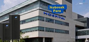 A imagem mostra a fachada de um hospital moderno com design de vidro e concreto, destacando a palavra **"HOSPITAL"** em letras azuis. No canto superior direito, o logotipo da **MVS Nobreak** reforça a identidade da marca. No primeiro plano, dois Nobreaks industriais são exibidos, simbolizando a importância desses equipamentos para a continuidade das operações hospitalares. No topo da imagem, um banner azul com texto amarelo diz **"Nobreak Para"**, enfatizando a aplicação dos equipamentos no setor hospitalar. A composição sugere a necessidade de Nobreaks para garantir o funcionamento ininterrupto dos hospitais, prevenindo falhas de energia que podem comprometer equipamentos médicos essenciais.